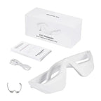 White eye massager with packaging, USB cable, and user manual on a white background