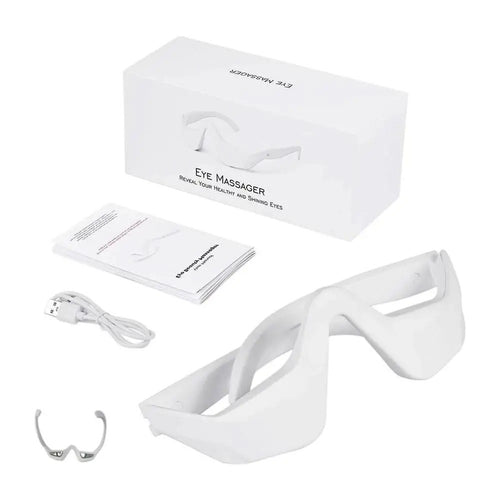 White eye massager with packaging, USB cable, and user manual on a white background