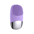 Purple silicone facial cleansing brush on a white background